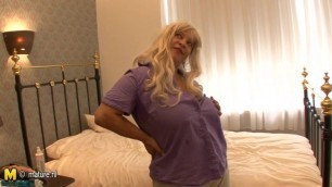 Blonde big titted mama getting wet on her bed