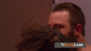 The swinger couple has a lustful moment of intimacy in the red room